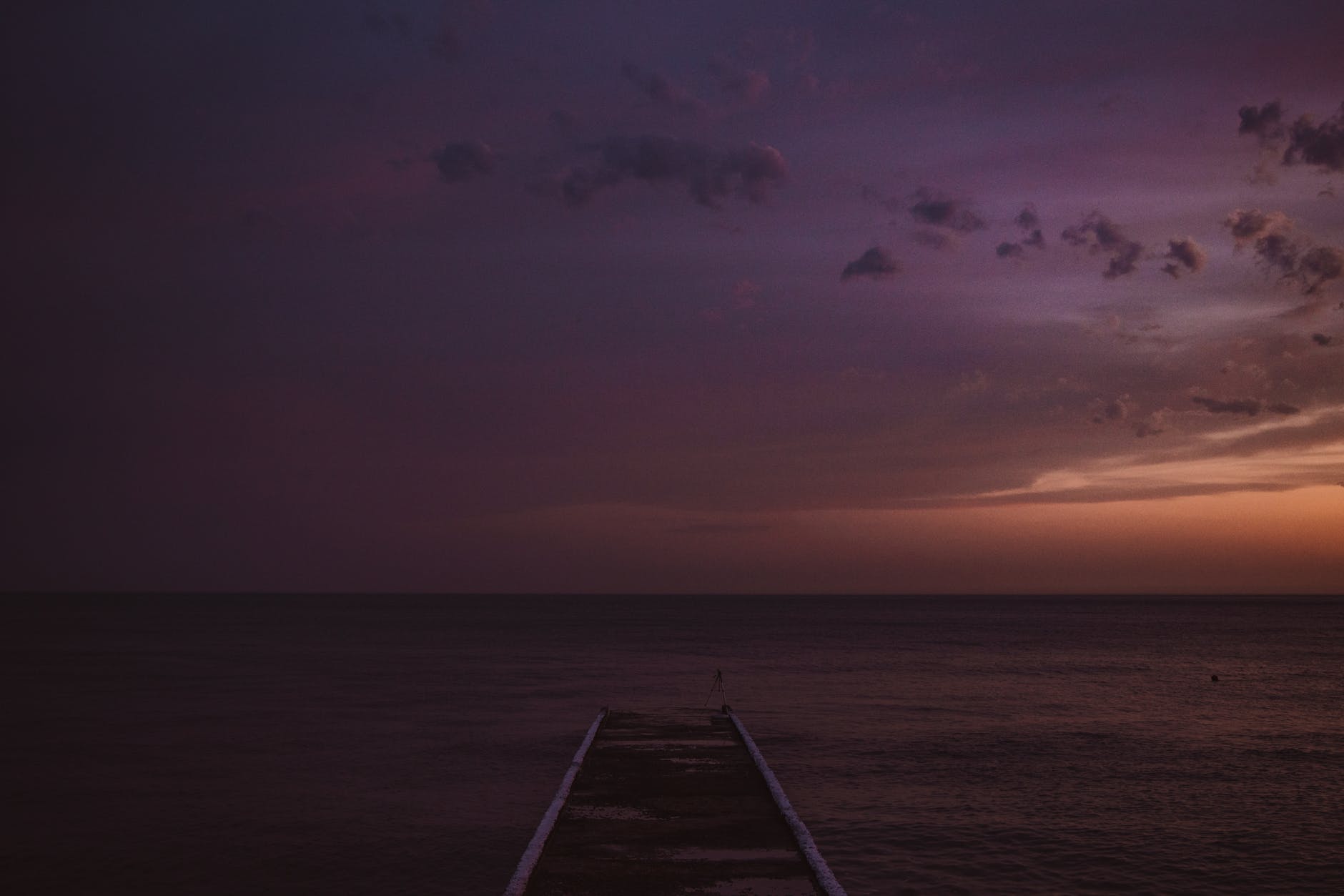 a wooden dock on the sea